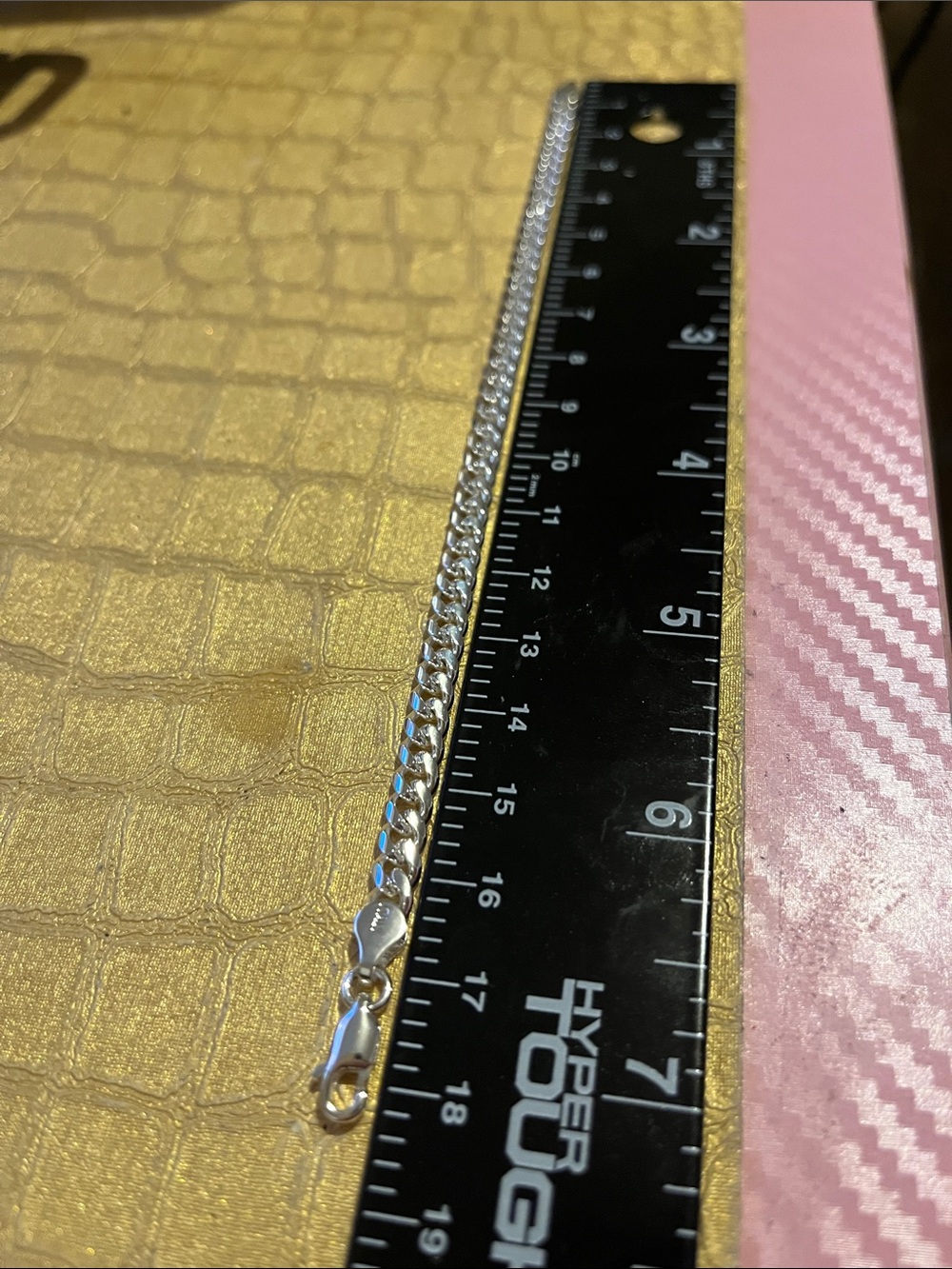 curb or Cuban link chain bracelet.